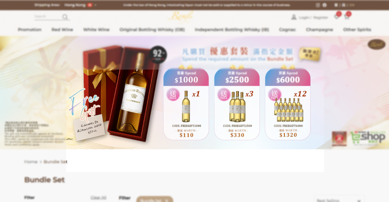 A promotional banner for Remfly Wines featuring a bottle of Carmes de Rieussec in a red gift box. Three reward tiers are shown: spend $1000 for 1 bottle, $2500 for 3 bottles, and $6000 for 12 bottles